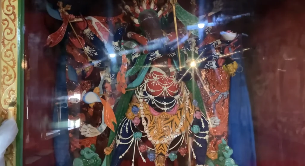 A colorful statue of Kali Mata displayed inside a Himalayan temple during the Manali to Ladakh road expedition.